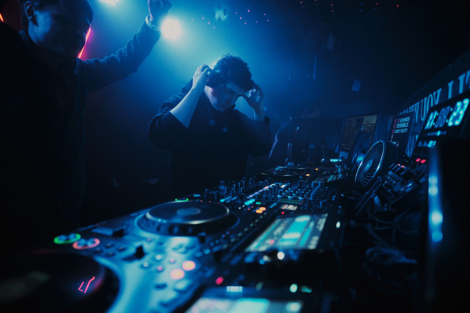 DFRACTD DJ setup with moving-head lighting