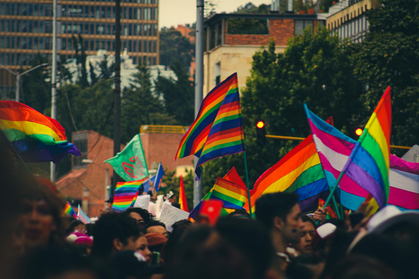 Vibrant Pride celebration with colourful lighting and dancing
